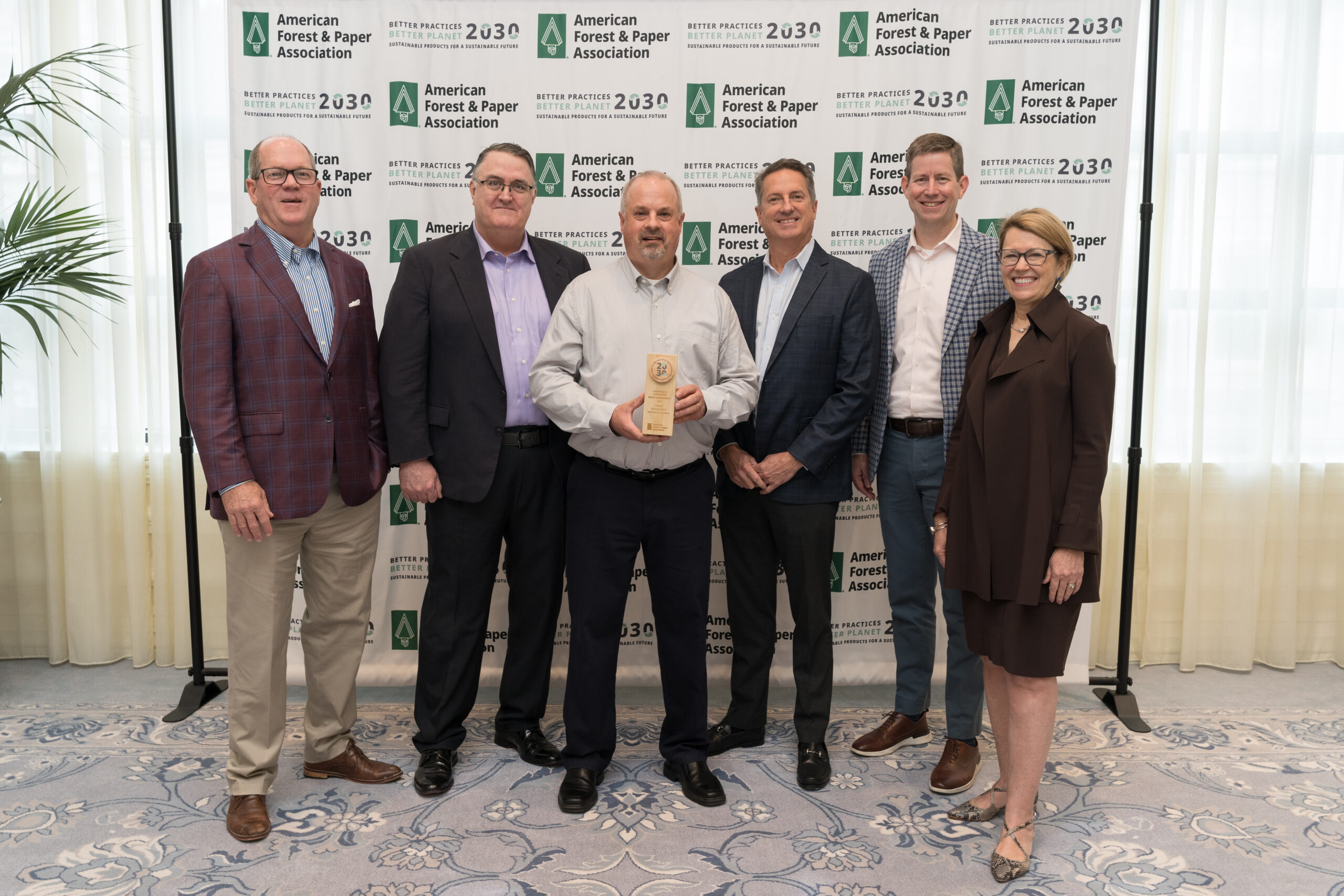 Domtar representatives accepted the 2024 AF&PA Leadership in Sustainability – Water Management Award for Domtar's water conservation program. They are shown standing in a group with representatives from AF&PA.