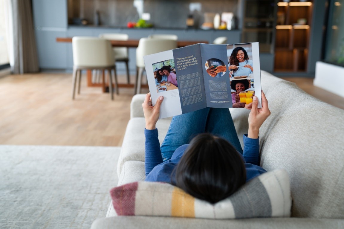 teenager looking at an open magazine